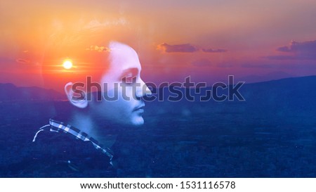 Double exposure portrait of a dreamy cute alone happy man face outdoors nature, sunrise or sunset cloud. closeup. Power of mind, brain memory inner voice concept. Fresh air yoga deep breath, live well Royalty-Free Stock Photo #1531116578