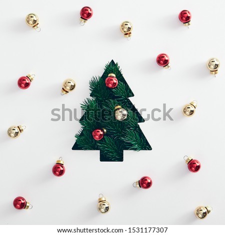 Christmas minimal concept - silhouette of christmas tree top view on white background with balls. Modern xmas tree shape branch, great design for any purposes. Creative christmas composition.