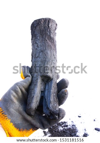 A miner's hand shows coal in a mine. The picture can be used to represent coal mining, an energy source, or environmental protection.