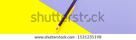 Minimal Flat Lay Top View Background Of Yellow And Purple Color Pencils For Drawing Isolated On Simple Backdrop. Conceptual Idea For Creative Workspace, School Stationery Equipment