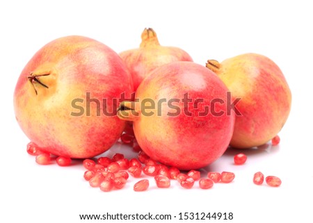 Red pomegranate isolated on white background