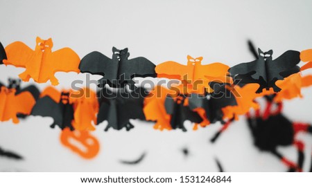 Halloween party decoration. Bats black and orange paper cut