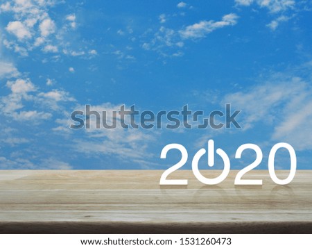 2020 start up business flat icon on wooden table over blue sky with white clouds, Happy new year 2020 concept
