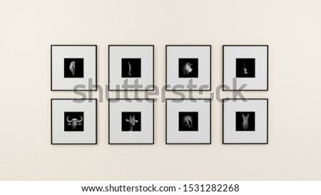 A wall of monochrome photographs of African wildlife