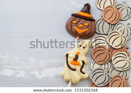 top view scary Halloween cookies ceramic background