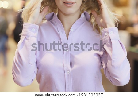 girl in a pink shirt element of clothing fragment, business style, cotton shirt, young woman