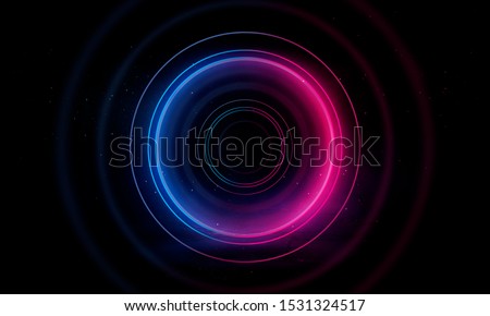 Neon circle on a dark street background, wet asphalt. Blue neon, smoke, smog. Night view of a street with neon. Abstract neon dark background. Royalty-Free Stock Photo #1531324517