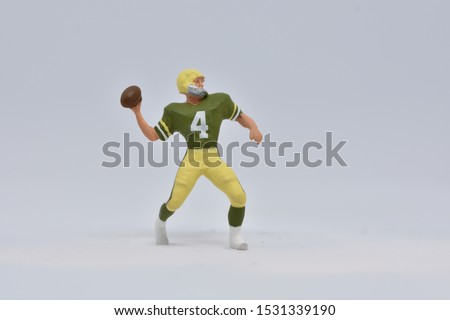 Quarterback in ho scale throwing american football
