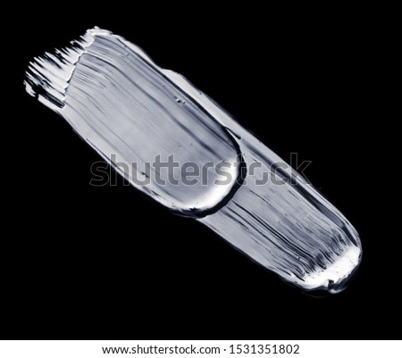 Beauty smear, cosmetics product and abstract liquid concept - Silver paint brush stroke texture isolated on black background, glamour make-up sample smudge