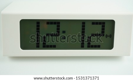 Digital alarm White clock time 12.12 am or pm on white background, Time concept.     
