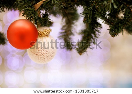 Christmas balls as decoration with artificial spruce on bokeh background. Copy space. place for your text or content