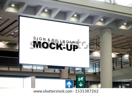 Mock up perspective horizontal billboard with clipping path on the wall of airport terminal over walkway, empty space for advertising or public information, advertisement concept