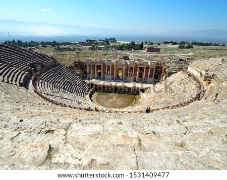 The Preserved Ruins Theater at Hierapolis with blue clear sky, the ancient city located at Pamukkale, the famous UNESCO World heritage Site in Denizli, Turkey. 