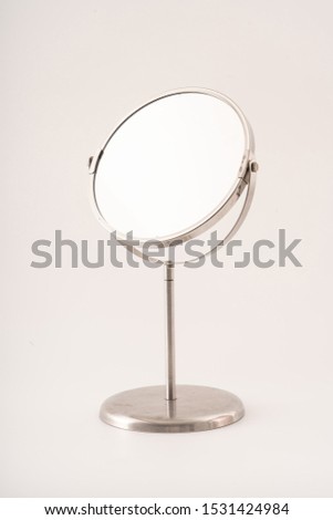 Chrome Makeup Mirror isolated on white. Royalty-Free Stock Photo #1531424984