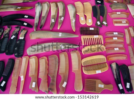 set of colorful combs.Combs on pink background.
