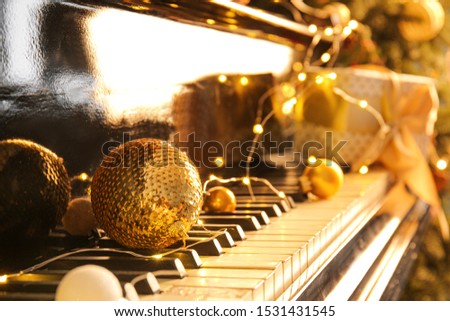 Piano keyboard with Christmas decor, closeup