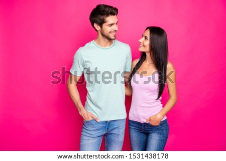 Photo of amazing couple guy and lady in love standing hugging enjoy best company wear casual clothes isolated bright pink color background