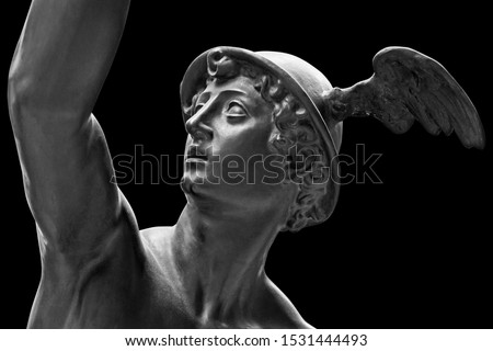 Ancient statue of the antique god of commerce, merchants and travelers Hermes - Mercury. He is olympic gods messenger with wings on a helmet. Sculpture isolated on black background by clipping path Royalty-Free Stock Photo #1531444493