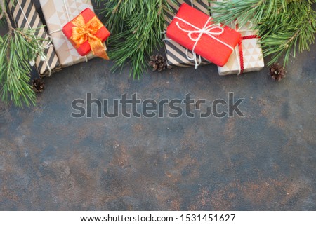 Christmas gift box. Christmas presents in red, white boxes at black and blue dark background. Flat lay with copy space.