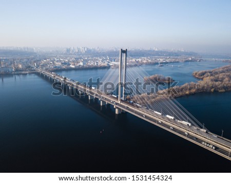 Aerial of the south bridge, city Kyiv Ukraine. South Bridge city of Kiev. The river of the Dnieper, the bridge crosses the river. City landscape from a bird's eye view bridge on river