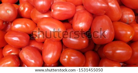 Background with red tomatoes. Photo