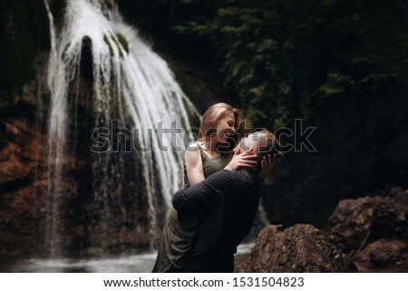 
A girl and a guy are resting in the mountains. Love between them