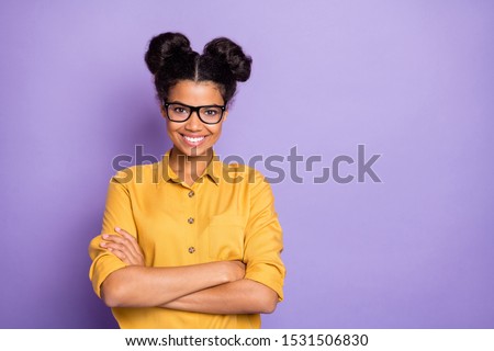 Photo of amazing pretty dark skin lady holding arms crossed positive working corporate mood wear specs yellow shirt isolated purple color background