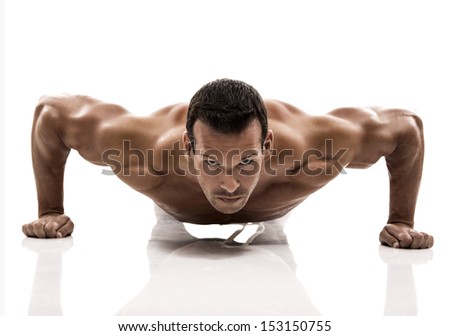 Muscle man dmaking push ups in studio, isolated over a white background Royalty-Free Stock Photo #153150755