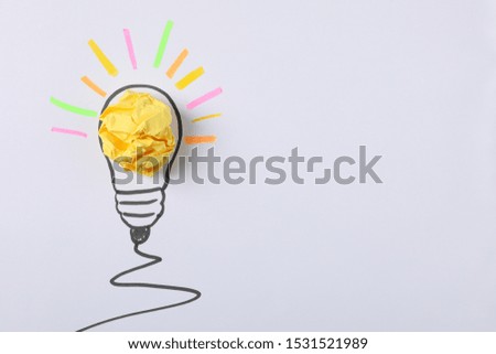 Drawn light bulb and paper ball on white background. Good idea concept