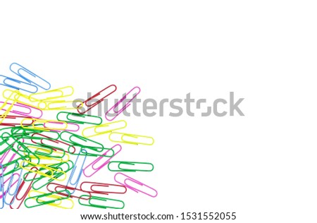 Colored paper clips isolated on white background without shadow. Bunch of colorful paper clips on white background. Multicolored paper clips with copy space