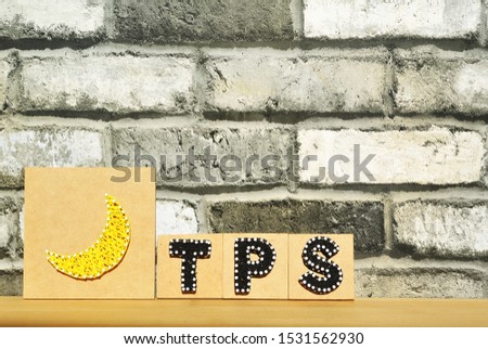 TPS made of brick and black thread