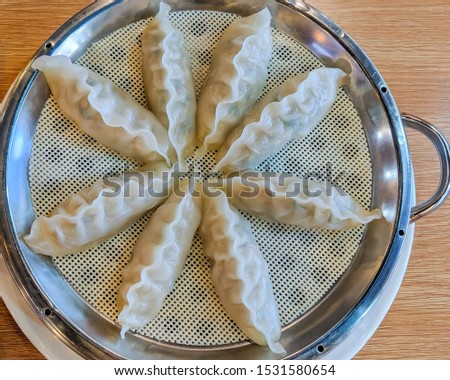 steamed prawn dumplings, dimsum har-gao. Steamed dimsum arranged in a flower form