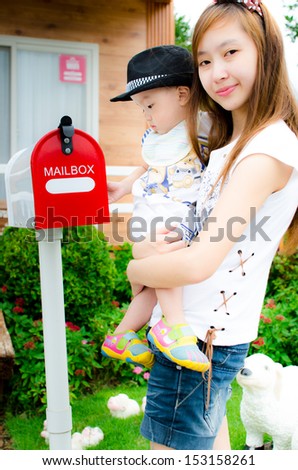 happiness asia baby and mom with mailbox