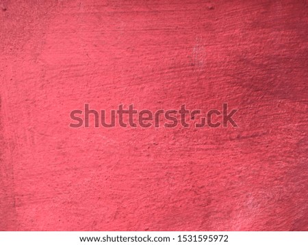 Red color cement wall background and texture 