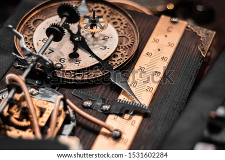 Steam punk Clockwork machinery and tools for time travelling. Hand made art, brass and golden details. Halloween theme, retro noir atmosphere. Industrial revolution concept.  Royalty-Free Stock Photo #1531602284