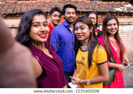 Happy young Indian peoples or friends taking selfie in village area