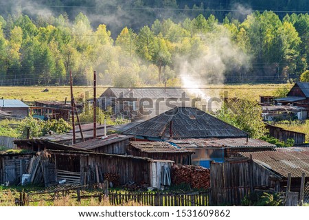 Mountain village in the rural wilderness. Russia, mountain Altai, Ongudaysky district, picture taken in the village of Tuecta