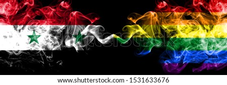 Syria vs Gay pride smoke flags placed side by side. Thick colored silky smoke flags of Syrian and Gay pride