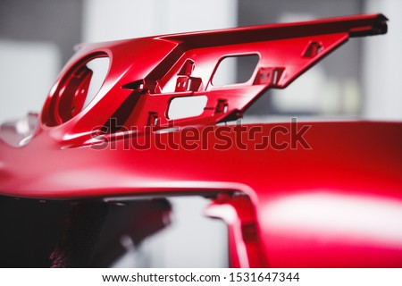 Part of the car body after painting is dried in the booth. Auto repair shop. Royalty-Free Stock Photo #1531647344