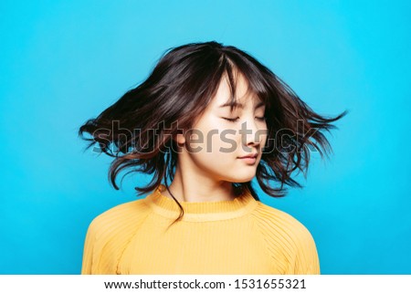 Hair care concept of young asian girl.
