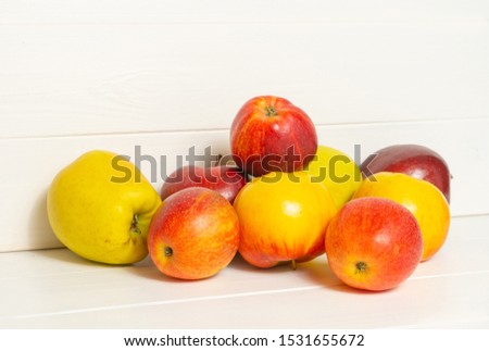 Red and yellow apples  on a white background. Harvest composition. Background with space for text.