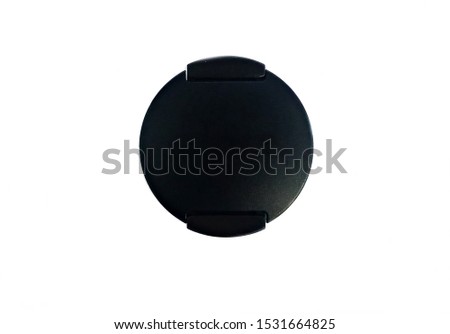 Black unbranded camera lens cap isolated on white background