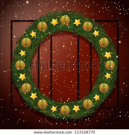 Christmas wreath with Gold Decorations on a Wooden Door Background