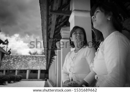 Black and White old style picture. Two asian women friends dressed in traditional Lanna costumes.
