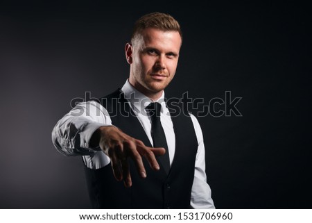 funny office worker giving hand for an handshake to seal the agreement isolated on black background, busisness,man is dancing, singing a rep. close up portrait,