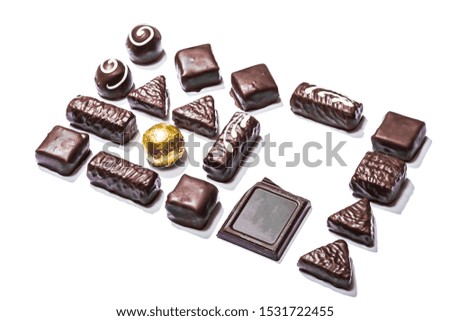 layout of chocolates of different shapes. Free space for your text. It can be used as a mockup. Isolated over white background.