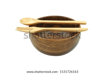 wooden spoon and fork put over bowl prepare for serve. Isolated on white background with clipping path