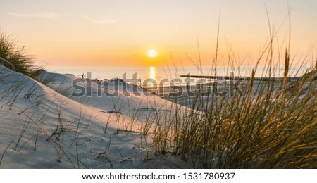 Sunset at the Baltic Sea Beach Royalty-Free Stock Photo #1531780937