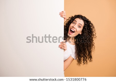 Photo of amazing lady holding big white placard presenting novelty information not believe sale prices wear white casual clothes isolated beige pastel color background Royalty-Free Stock Photo #1531800776
