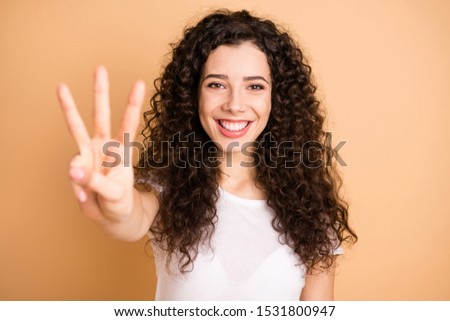 I'm counting to three! Closeup photo of funny lady raising hand showing three fingers positive mood wear white casual outfit isolated beige pastel color background